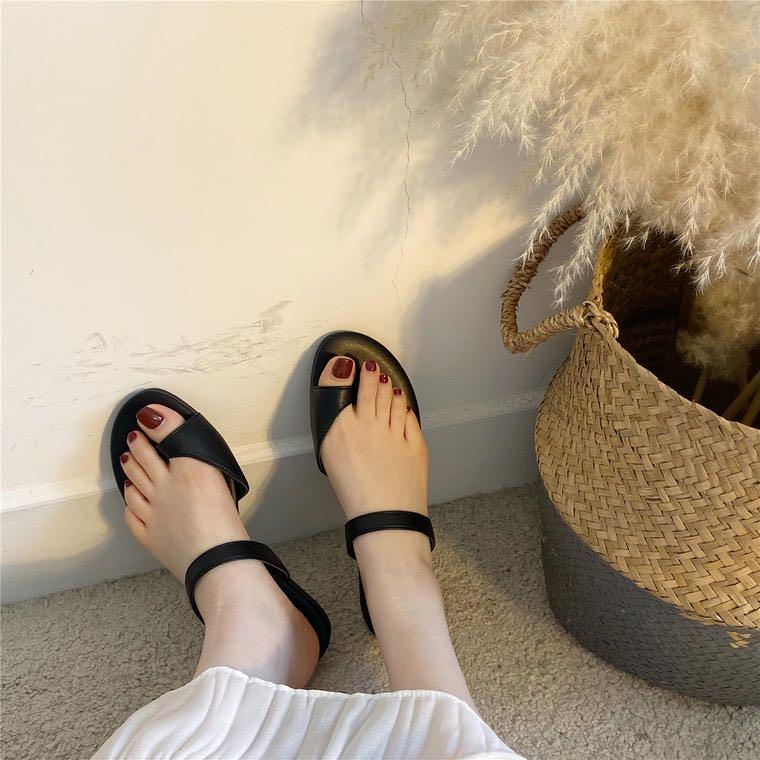 tan flats with black toe
