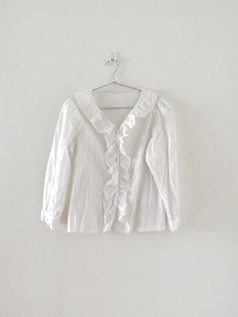 white ruffle blouse
