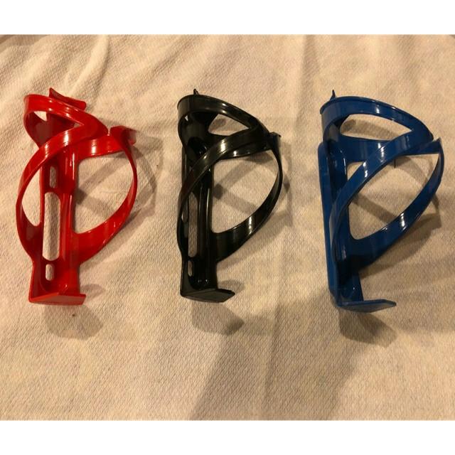 Bike bottle holder / bottle cage (Category: Everything Else Others) located in Las Pinas. Submitted by k.circle (Listing ID 1027618352, Image 3). Description: Material: PC plastic Color: White, Red, Black, Blue Size: 145*75*75mm/5.71*2.95*2.95" Net weight: 22g Gross weight: 22g Fit: All kinds of vehicle frame with water bottle holder mounting hole.
