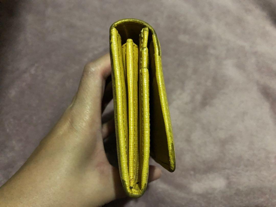 Fendi long wallet in yellow (Category: Luxury Bags & Wallets) located in San Pedro. Submitted by allenaaa (Listing ID 1027696289, Image 3). Description: Fendi long wallet in yellow. Rfs: Decluttering Flaws can seen on the posted pics. Corner scuffing. .