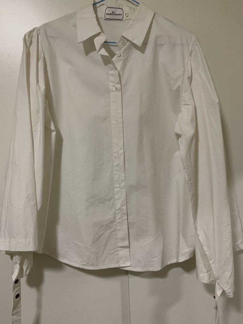 white blouse with flowy sleeves