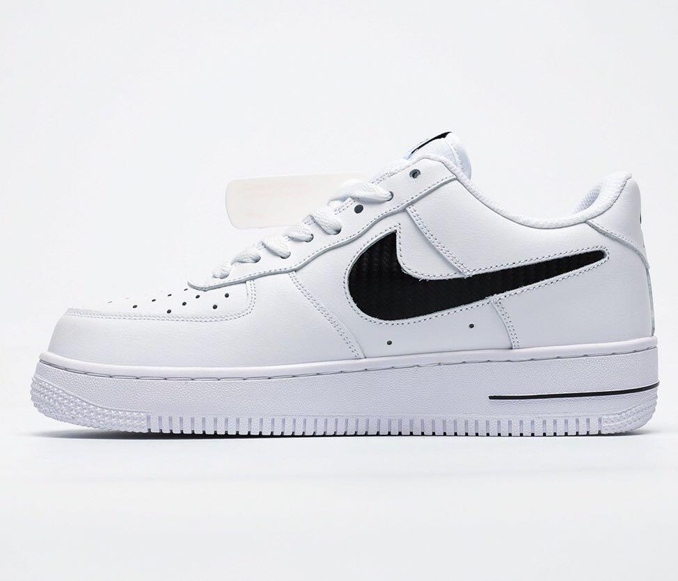 white nike air force with black swoosh