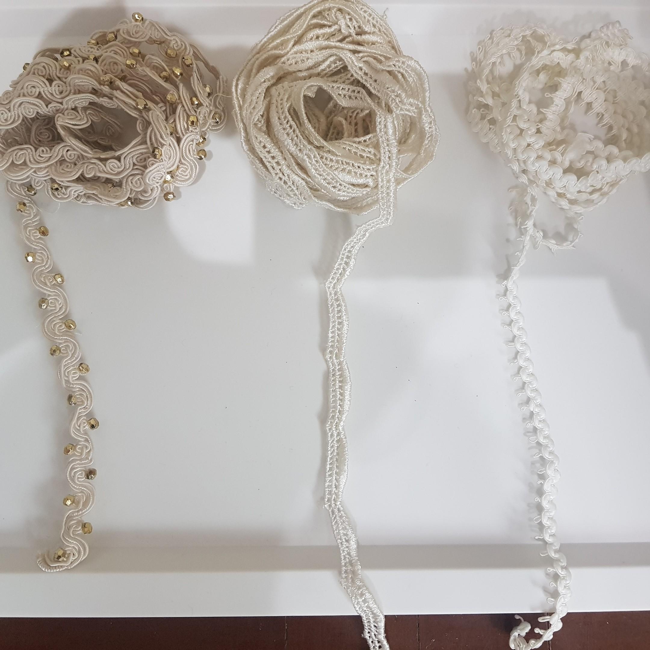 Trims bundle (Category: Craft Supplies & Tools) located in Taguig. Submitted by shopsaleph (Listing ID 1028308408, Image 3). Description: Trim bundle for clothing. Ivory color. Left wavy design 2.5yds (half beaded in gold beads) . Center 3.5yds. Right scallop design 1.5yd.