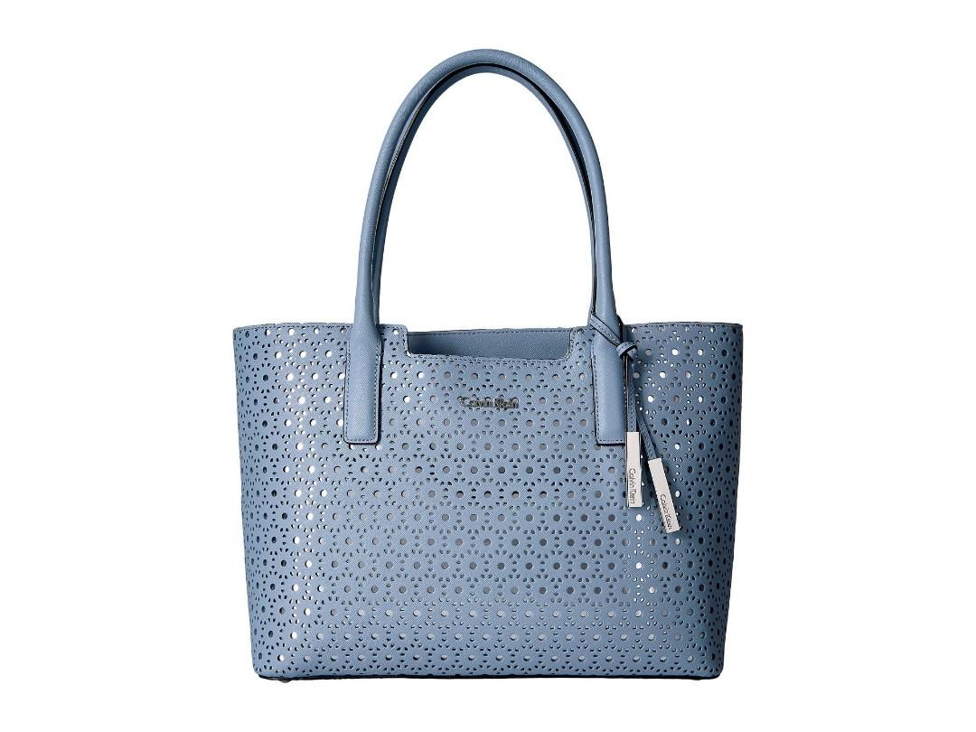 CALVIN KLEIN SAFFIANO LEATHER LIGHT BLUE ON A SILVER BACKGROUND PERFORATED  TOTE, Women's Fashion, Bags & Wallets, Beach Bags on Carousell