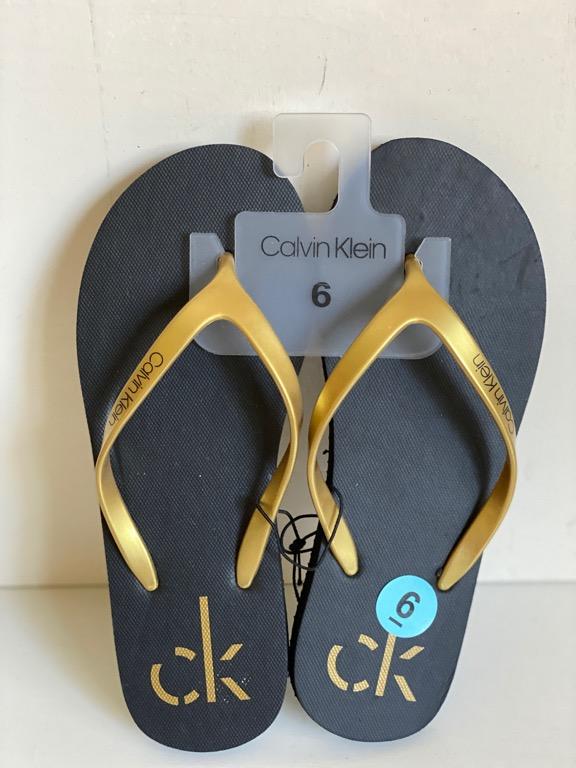 black and gold flip flops