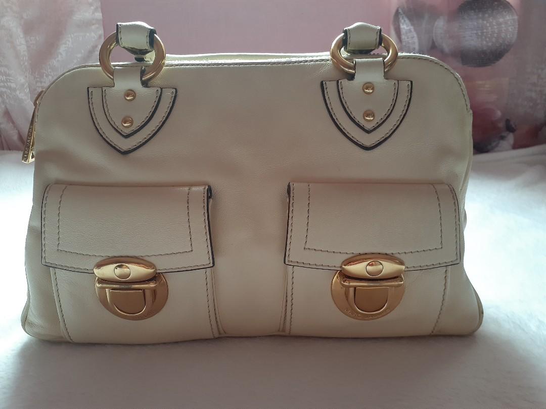 REPRICED-MARC JACOBS (Category: Luxury Bags & Wallets) located in Pasig City. Submitted by shemiyu (Listing ID 1025292885, Image 1). Description: Authebtic Marc Jacobs cream bag, good as new. 3 compartments, 1 zipped pocket, gamusa lining, gold hardwares, no tarnish, riri zipper. Price is negotiable. pm me for more details.