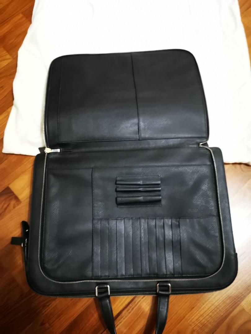Prada Briefcase Saffiano Leather (Category: Bags & Wallets) located in Singapore. Submitted by goodoldrollie (Listing ID 1023973068, Image 3). Description: Prestine condition, used less than 10 times. Almost as good as new. Slight nego for serious buyer. Comes with dust bag. Selling as no longer working corporate..