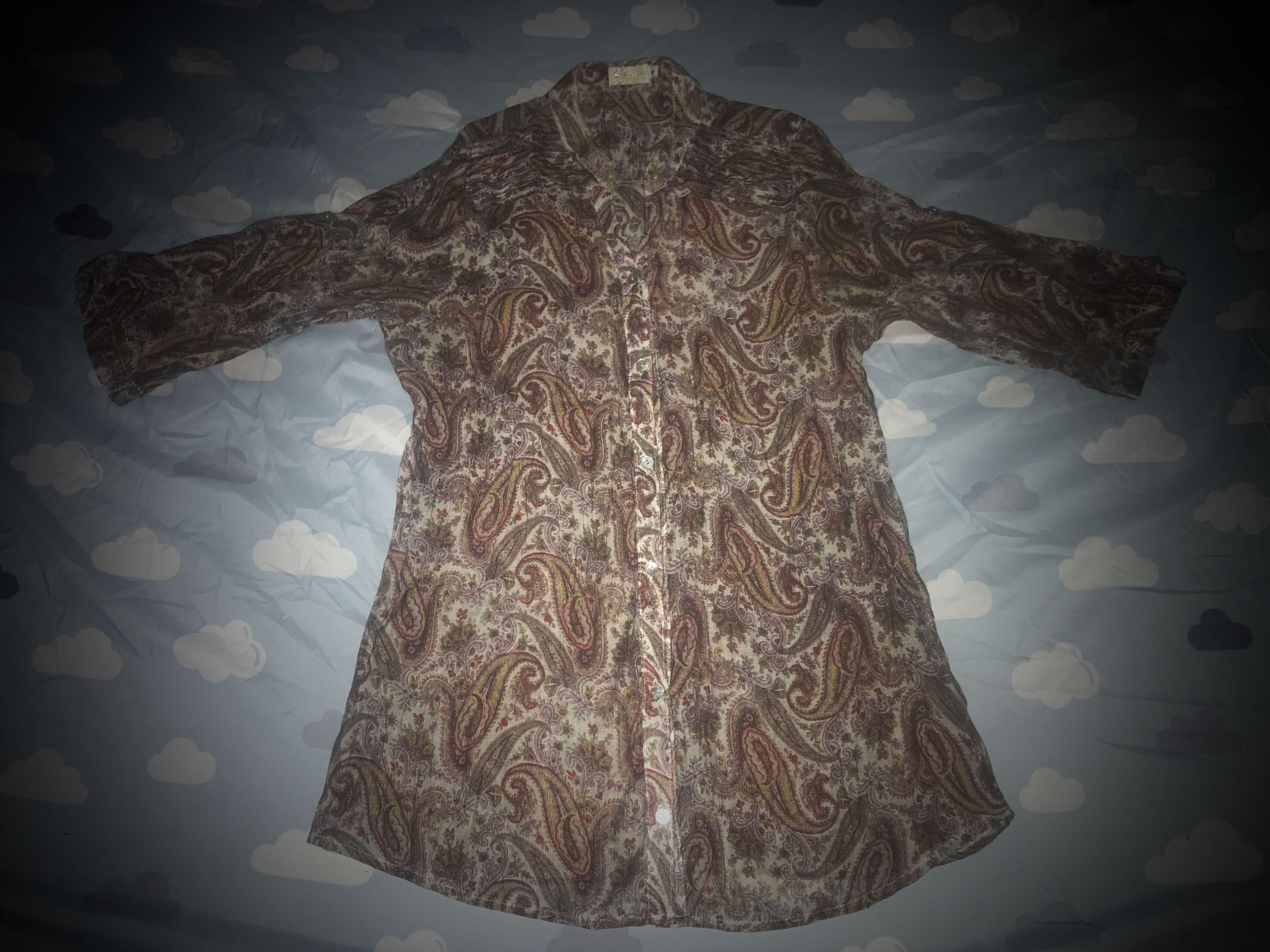 Paisley Printed Button Down Blouse (Category: Blouses) located in Quezon City. Submitted by igraine_21 (Listing ID 1029710467, Image 1). Description: •VGUC •Preloved but well loved. •Worn 3x only •Crinkled chiffon fabric(semi-sheer) •3/4 sleeved RFS: -Declutering -Outgrown.