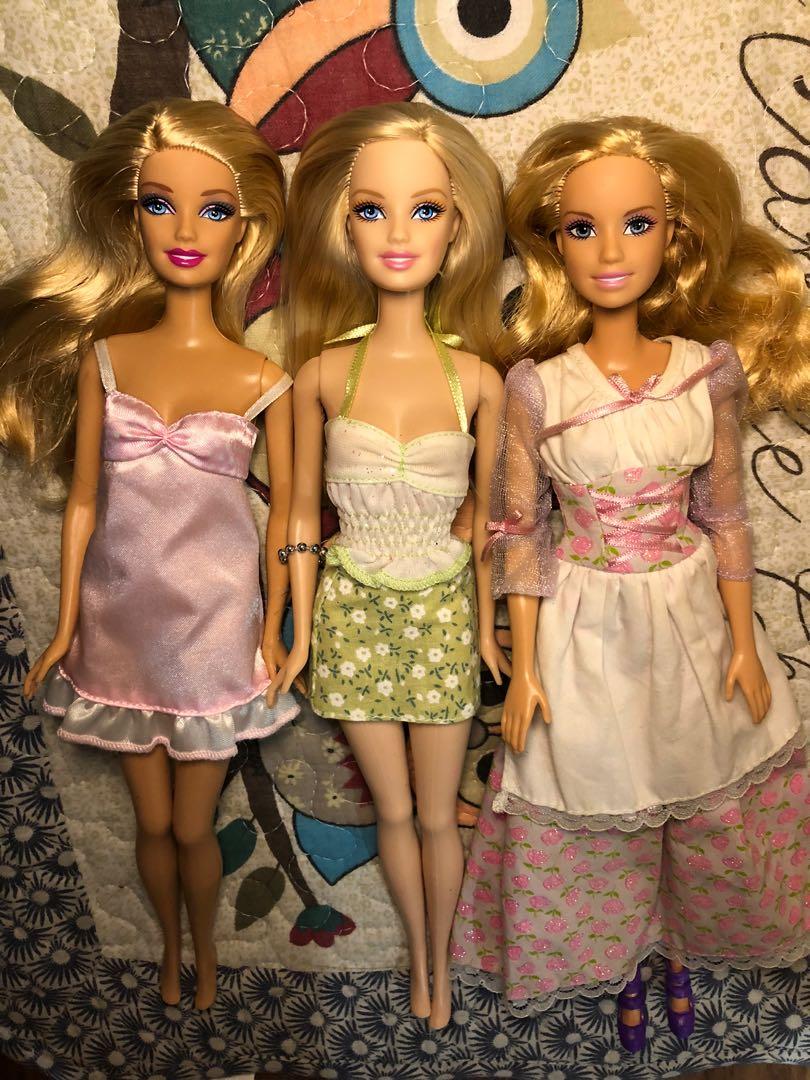 three barbie dolls