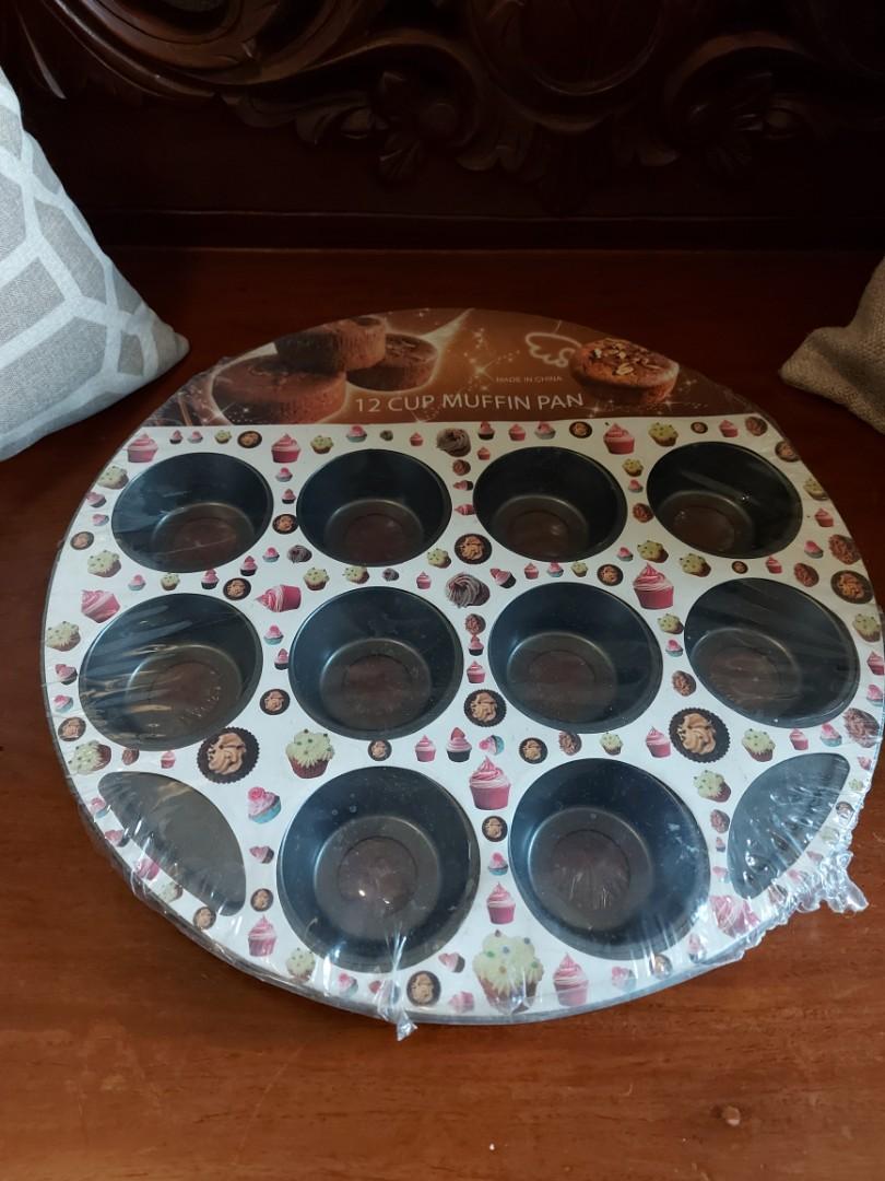 12 Cup Muffin Pan (Category: Bakeware) located in Quezon City. Submitted by luffy28 (Listing ID 1030454181, Image 1). Description: Brand New Muffin Pan -For baking -12 holes - Stainless steel -Non-stick -Unopened and with plastic.