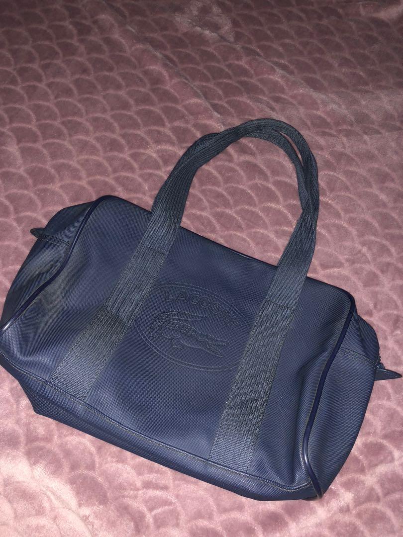 Lacoste bowler bag (Category: Tote Bags) located in San Pedro. Submitted by allenaaa (Listing ID 1030569262, Image 1). Description: Lacoste bowler bag Size: Medium-Large Rfs: Decluttering Flaky part inside as seen in pics but still usable. All pics are posted..