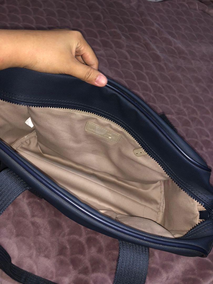 Lacoste bowler bag (Category: Tote Bags) located in San Pedro. Submitted by allenaaa (Listing ID 1030569262, Image 3). Description: Lacoste bowler bag Size: Medium-Large Rfs: Decluttering Flaky part inside as seen in pics but still usable. All pics are posted..