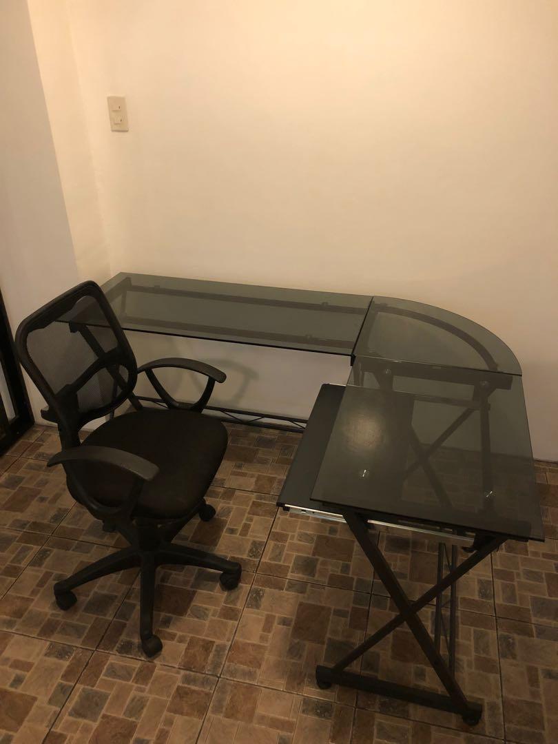 Office Tempered Glass Table with Chair (Category: Tables & Sets) located in Manila. Submitted by a.veloso (Listing ID 1030339247, Image 1). Description: Premium Tempered L shaped office/computer table Dimensions: long table Length 160 cm Computer table lenght:120 cm With sliding keyboard rack .