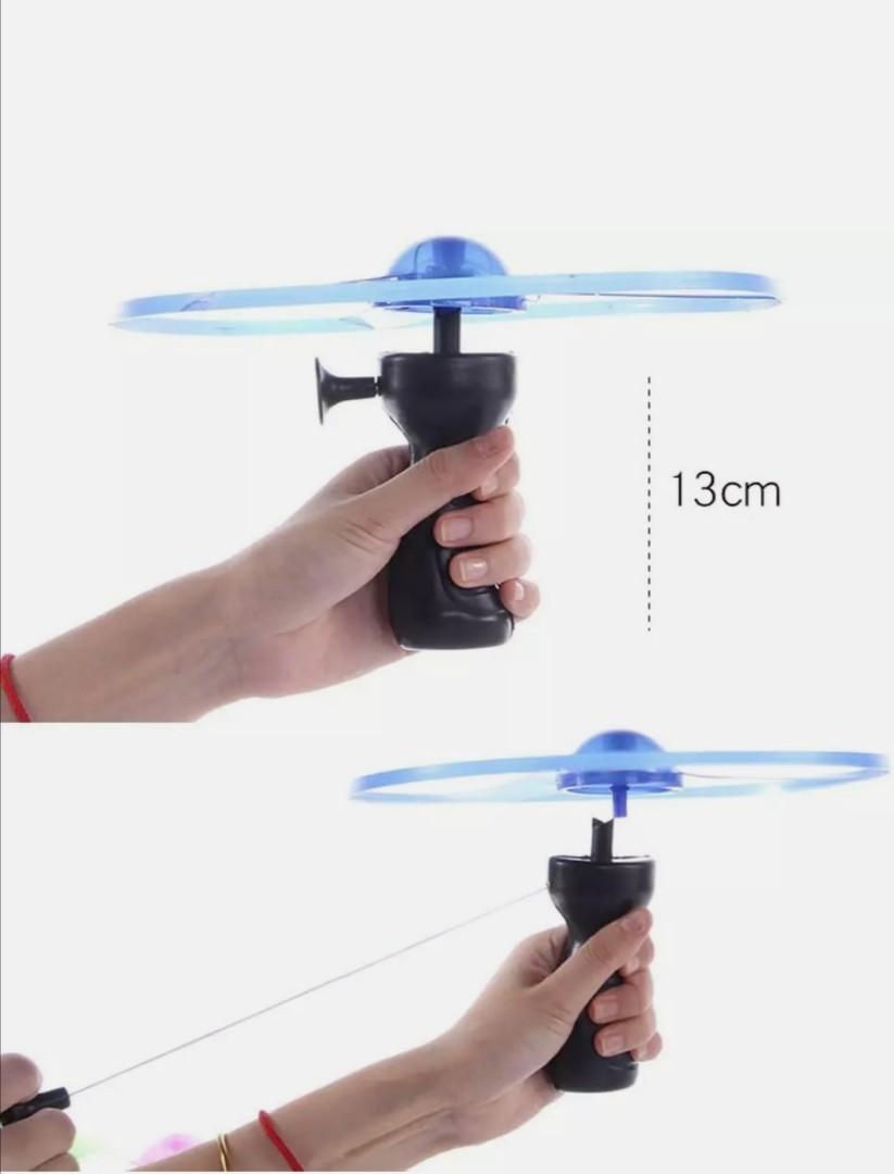 String pull Led UFO (Category: Other Kids Furniture) located in Singapore. Submitted by shockdear (Listing ID 1030718581, Image 3). Description: - Material: Flying Object are made of plastic, LED, light weight.The material is no harm to the body. - Easy to Launch: Lock a wing on the easy-grip launcher, and just pull the string and it creates wonderful spinning effect. - Great Fun: LED Flying Object Toys suitable for flying in the open area, perfe
