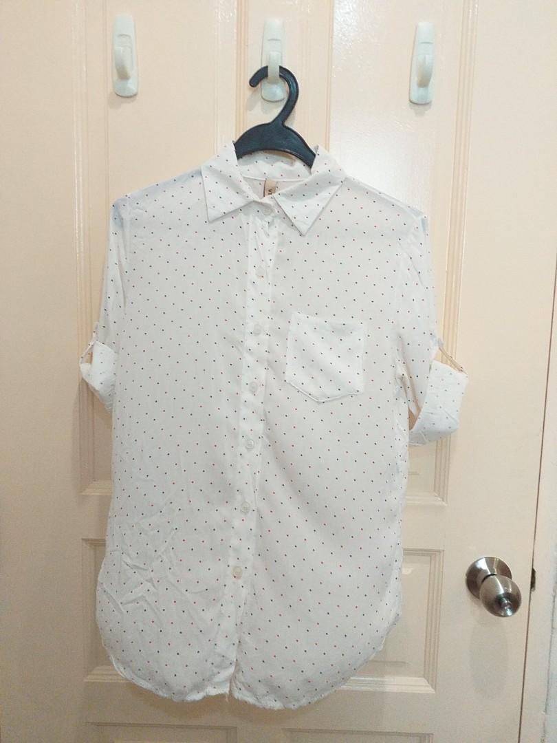 white shirt with navy polka dots