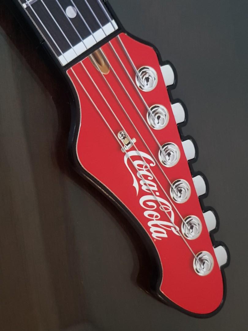 Coca-Cola Coke Electric Guitar (Category: Musical Instruments) located in Mandaluyong City. Submitted by urumikanzaki (Listing ID 1031230388, Image 2). Description: Battery Operated, 3 AAA. Built-in speaker still plays good sound and music. Not an actual guitar..