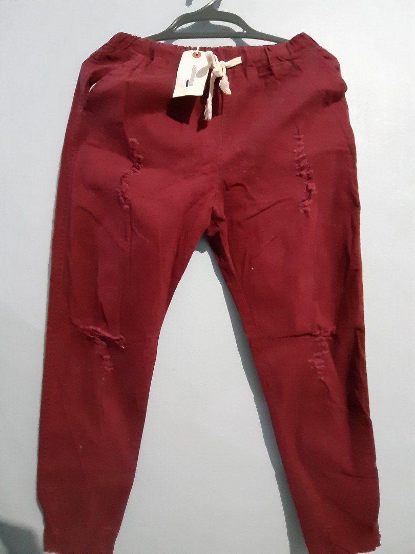 red jeans ripped