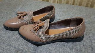 Brown flat shoes