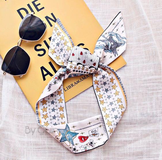Dior Twilly (for hair, wrist, bag, clothes) (Category: Hair Accessories) located in Taguig. Submitted by annebydesign (Listing ID 1031255821, Image 1). Description: CD Paris Shooting Star Constellation Silk Scarf/Twilly 💛 •Sold at Posh for $75 •On hand, brand new for ₱150 Great for personal use of Xmas gift or even for exchange gift 🎁 Last photo is the Orig Paris scarf #scarfstyle #scarffashion #silkheadscarf #bagaccessories #silkscarf.