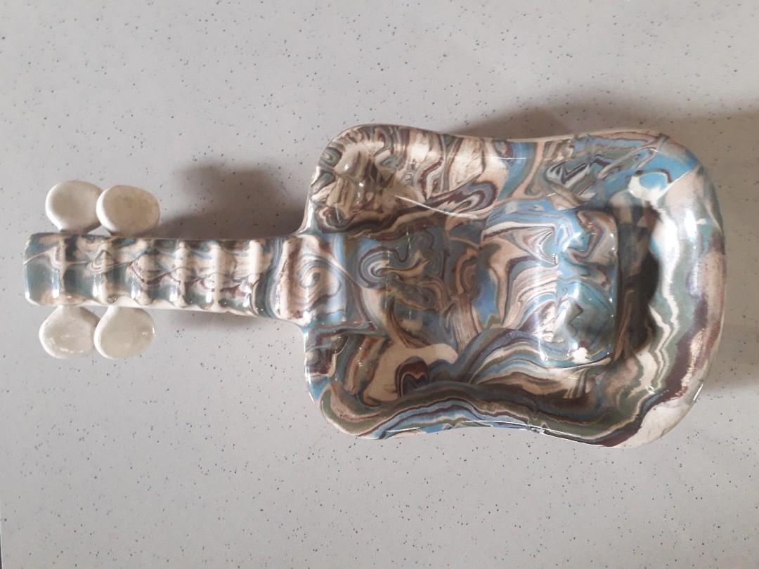 Vintage Ceramic Guitar Design Ashtray (Category: Other Kitchenware & Tableware) located in Quezon City. Submitted by lots2love (Listing ID 1031257441, Image 1). Description: Used vintage ceramic guitar design ashtray In good condition Location: Roxas District, QC.