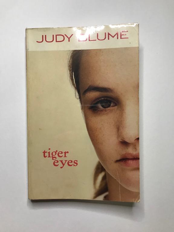 Tiger Eyes by Judy Blume (Category: Storybooks) located in Quezon City. Submitted by declutterion (Listing ID 1031519718, Image 1). Description: "Tiger Eyes" is a 1981 novel about a teenage girl trying to cope with the sudden death of her father. Its original price in 2013 was P399, but I'm selling it for just P80! The pages of the book is yellowing due to old age, and even though it's been plastic-wrapped, there are some scratches on the book it