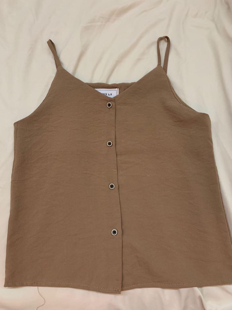 button down top (Category: Blouses) located in Singapore. Submitted by joyyamm (Listing ID 1031789002, Image 2). Description: all are brand new selling one for $5 super pretty piece,, can pair with almost anything selling cheap because i have a lot of the same pieces as well.