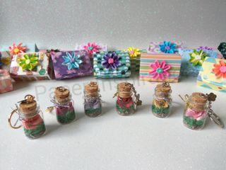 Miniature origami rose-in-a-bottle keychain gift set