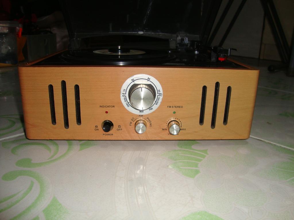 Turntable radio player (Category: Portable Music Players) located in Manila. Submitted by parokya_ni_edgar (Listing ID 1032101203, Image 3). Description: Features: 100 volts Built in speakers AM & FM radio.