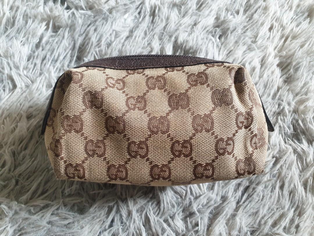 Authentic Gucci Pouch (Category: Luxury Bags & Wallets) located in Pasig City. Submitted by kimjayson (Listing ID 1025848693, Image 1). Description: Authentic Gucci Pouch in Monogram canvass with leather trim. Mint condition Yes Authentic po. Not Replica. Not class A. Dimension L7xW3xh3.5 Preloved market value of this condition is 7k+ Monogram canvass is flawless Zipper is crisp leather trim in mint condition Interior is clean No Lowballers! Paym