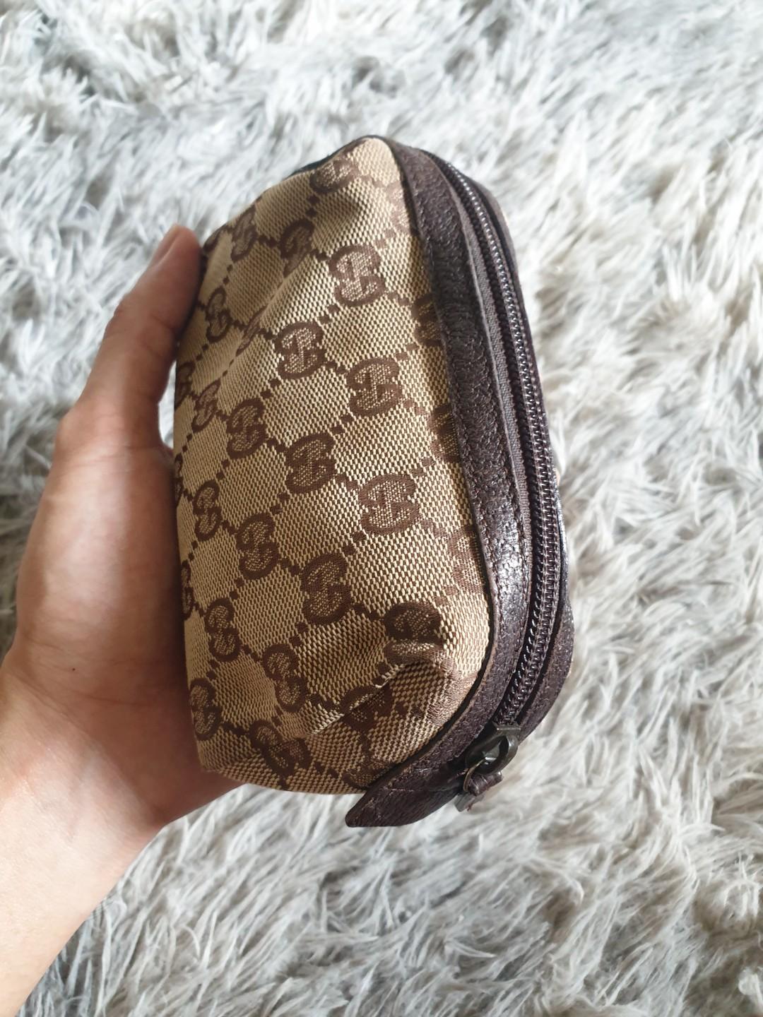 Authentic Gucci Pouch (Category: Luxury Bags & Wallets) located in Pasig City. Submitted by kimjayson (Listing ID 1025848693, Image 2). Description: Authentic Gucci Pouch in Monogram canvass with leather trim. Mint condition Yes Authentic po. Not Replica. Not class A. Dimension L7xW3xh3.5 Preloved market value of this condition is 7k+ Monogram canvass is flawless Zipper is crisp leather trim in mint condition Interior is clean No Lowballers! Paym