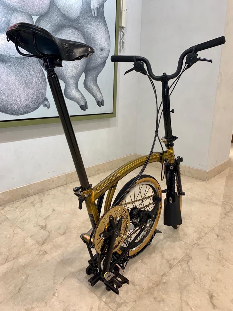 Brompton (Category: Bicycles) located in Singapore. Submitted by mnmxpl (Listing ID 1025858242, Image 4). Description: Asia Gold M6L limited edition, Serial number 135 / 1000, Condition 9.9/10, Laminated Bike Shield, Additional parts: Ti pro as photos, MKS paddle, Box, manual, certificate..