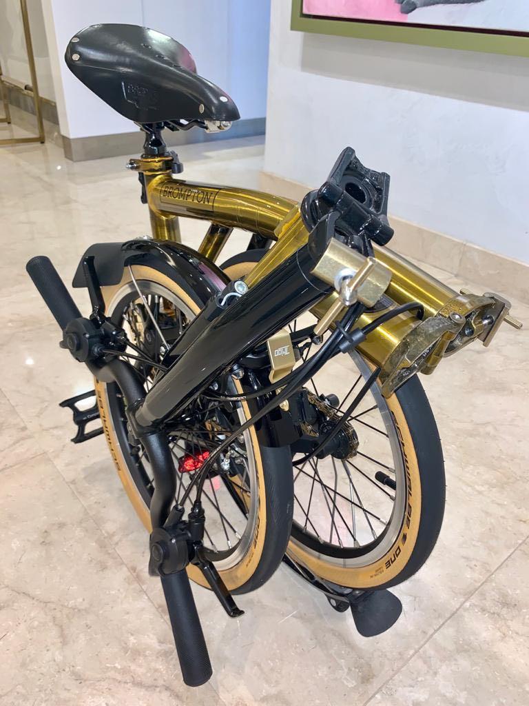 Brompton (Category: Bicycles) located in Singapore. Submitted by mnmxpl (Listing ID 1025858242, Image 7). Description: Asia Gold M6L limited edition, Serial number 135 / 1000, Condition 9.9/10, Laminated Bike Shield, Additional parts: Ti pro as photos, MKS paddle, Box, manual, certificate..