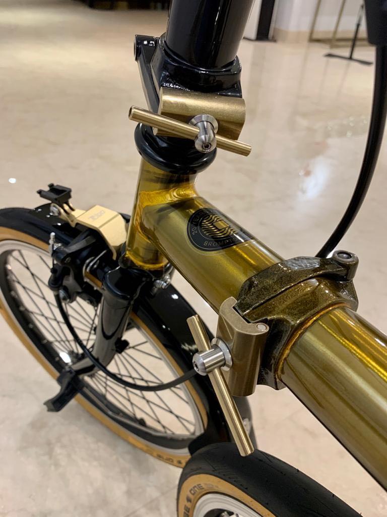 Brompton (Category: Bicycles) located in Singapore. Submitted by mnmxpl (Listing ID 1025858242, Image 6). Description: Asia Gold M6L limited edition, Serial number 135 / 1000, Condition 9.9/10, Laminated Bike Shield, Additional parts: Ti pro as photos, MKS paddle, Box, manual, certificate..