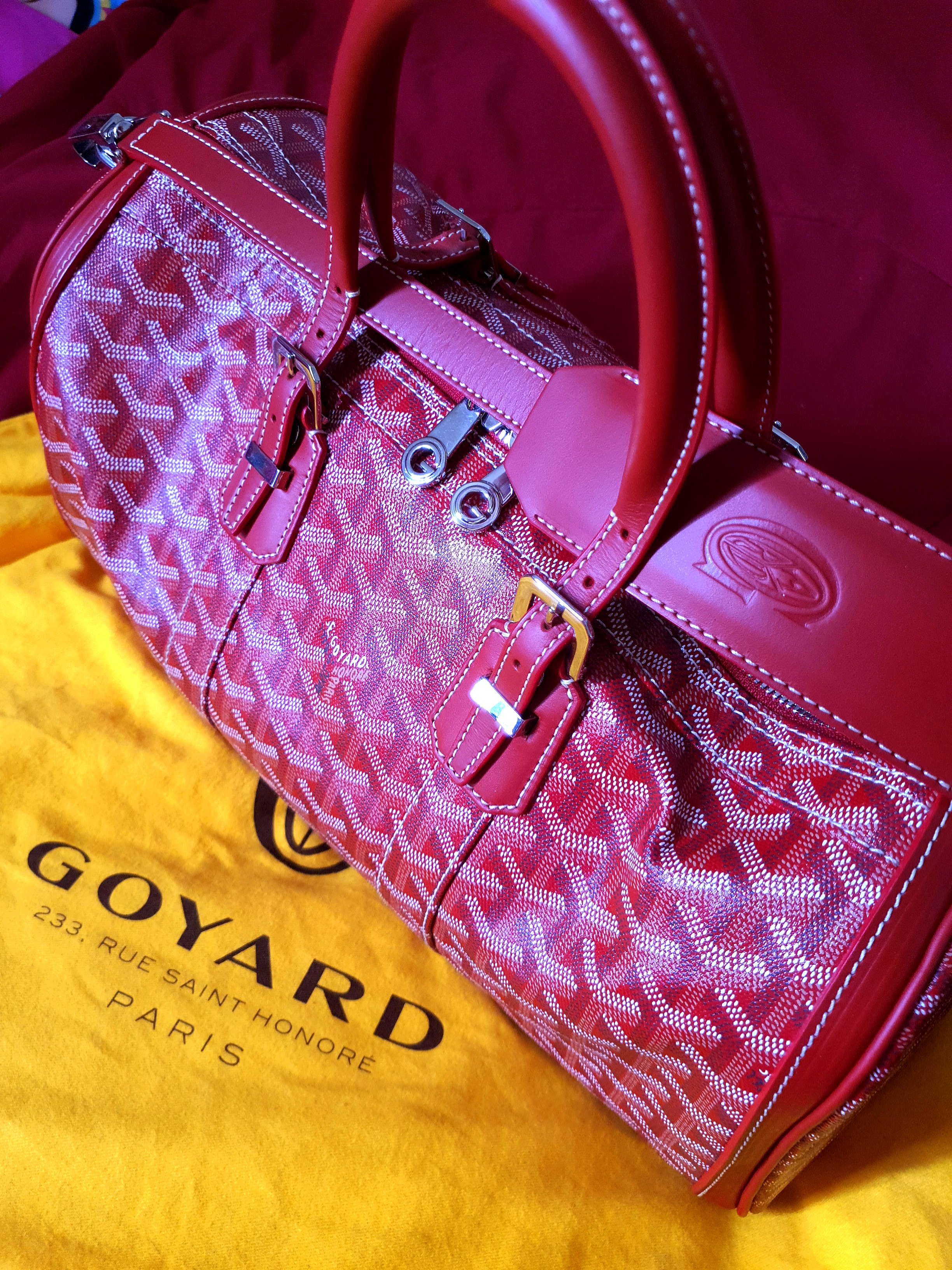 Red goyard online duffle bag