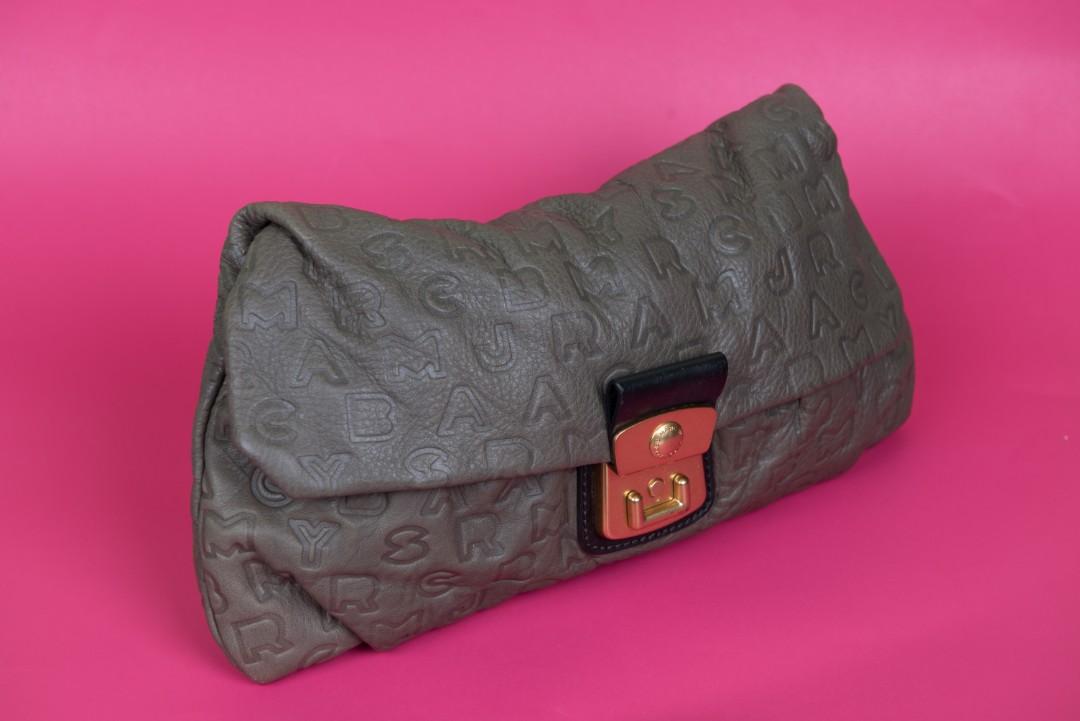 Marc by Marc Jacobs Leather Clutch Bag (Category: Luxury Bags & Wallets) located in Las Pinas. Submitted by destineshoppe (Listing ID 1026013590, Image 1). Description: Marc by Marc Jacobs Fuchsia Leather Clutch Bag 4,999php only Pre-Owned Pouch monogram marc by Marc Jacobs. Width 34 cm and height 19 cm. Colorful iterior fabric with zip pocket and 2 pockets, closure with gold clasp..