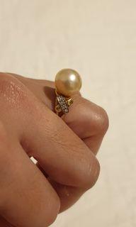 South sea pearl,  set in 14k gold with titus diamonds.