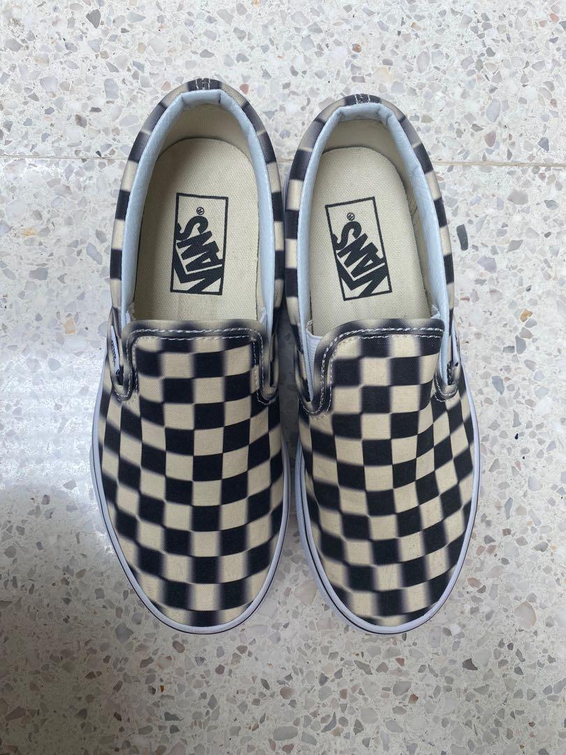 blurred checkered slip on vans