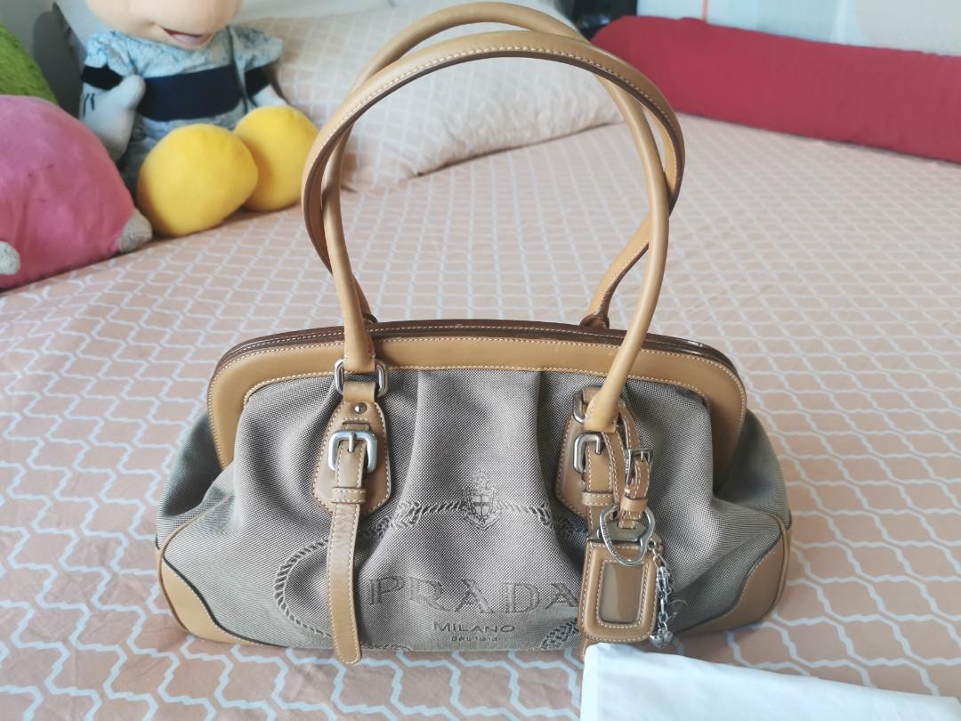 Prada Jacquard Logo handbag (Category: Luxury Bags & Wallets) located in Makati City. Submitted by denvergirl1119 (Listing ID 1026902737, Image 2). Description: Authentic preloved jacquard logo Prada handbag. With dustbag and authenticity cards. Gently used, with minimal signs of usage. Still nice..