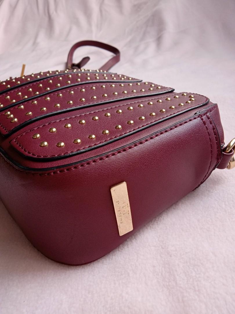 Maroon Studded Sling Bag (Category: Cross-body Bags) located in Marikina City. Submitted by thesecondroomph (Listing ID 1027105586, Image 3). Description: never been used.