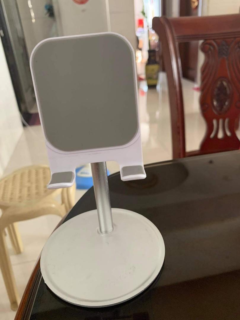 Cp and tablet holder (Category: Mounts & Holders) located in San Juan City. Submitted by dollmac (Listing ID 1032336981, Image 1). Description: best seller white and black color.