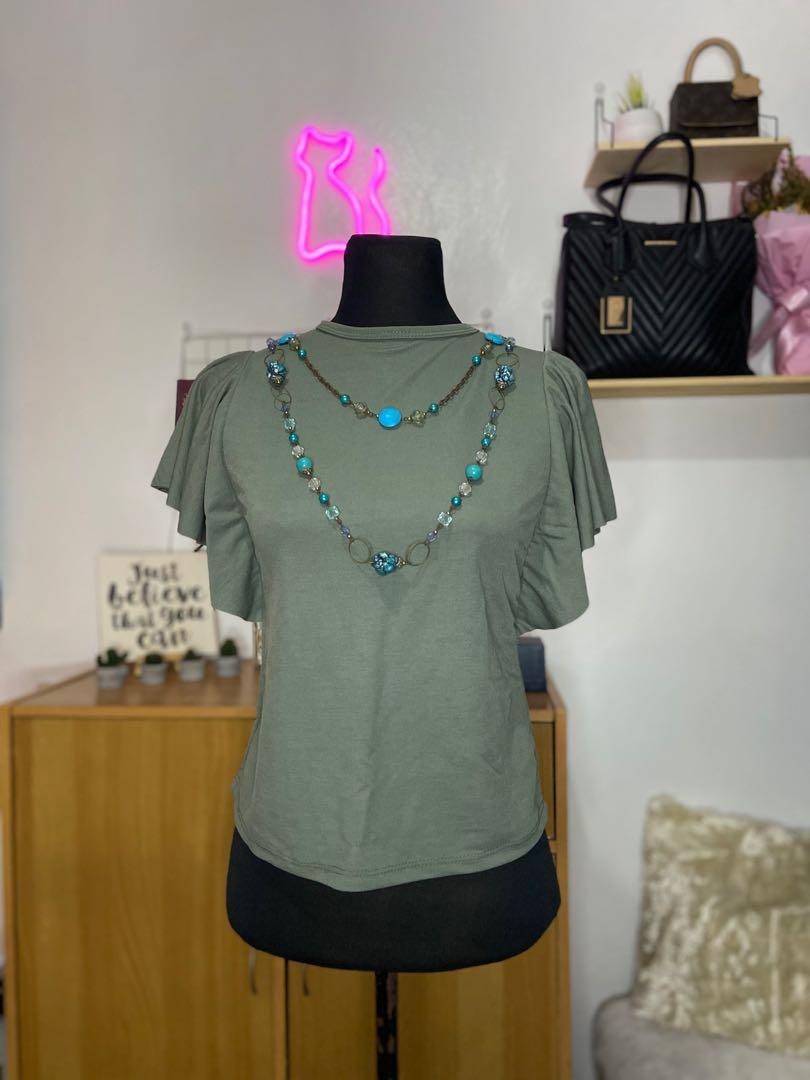 Green round neck ruffled top (Category: Sleeveless) located in San Jose del Monte. Submitted by _ecjc (Listing ID 1032447058, Image 1). Description: #top #sale.
