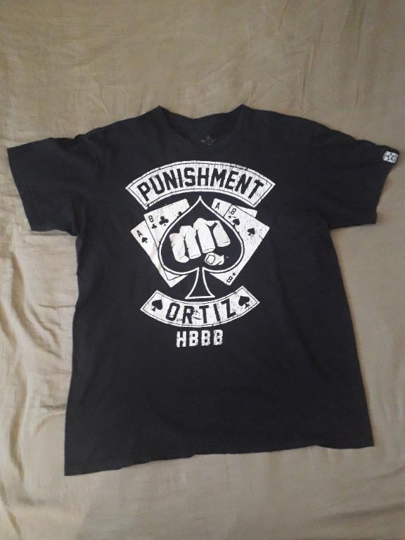 Punishment Tito Ortiz Shirt (Category: Formal Shirts) located in Paranaque City. Submitted by evtg_supply (Listing ID 1032434735, Image 1). Description: Tito Ortiz, the Huntington Beach Bad Boy, shirt Brand : Starfist Brand - Punishment Athletics Made In : Unknown Size : XL (W: 23", L: 28") Condition: Very Good - strong print with designed cracking, no rips, no tears https://evtgsupply.wixsite.com/evtg.