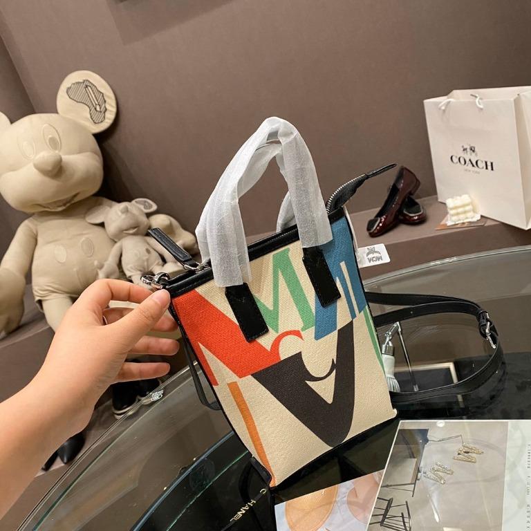 Mcm logo glitch mini canvas shopper clearance