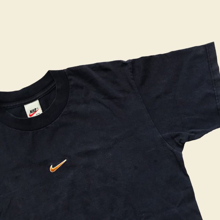 nike tee with swoosh in the middle