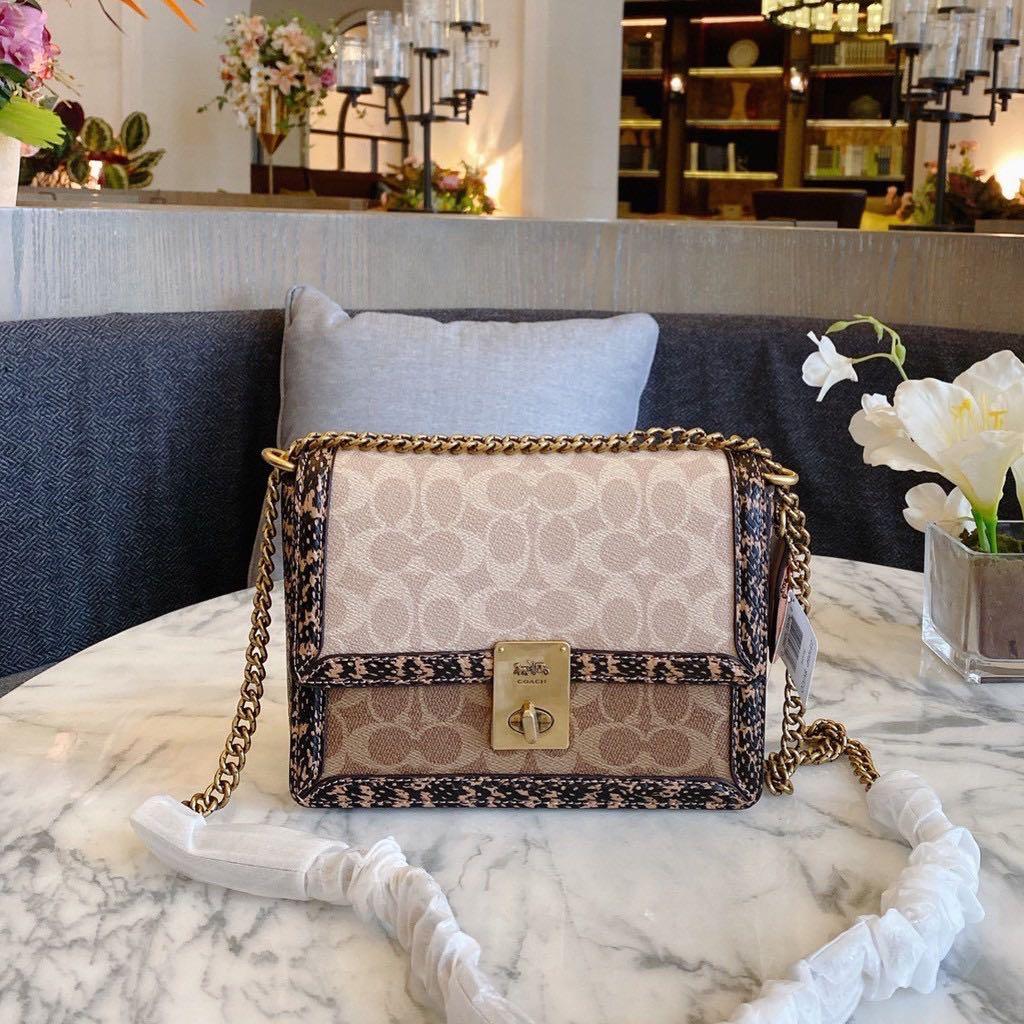 hutton shoulder bag in signature canvas with snakeskin detail