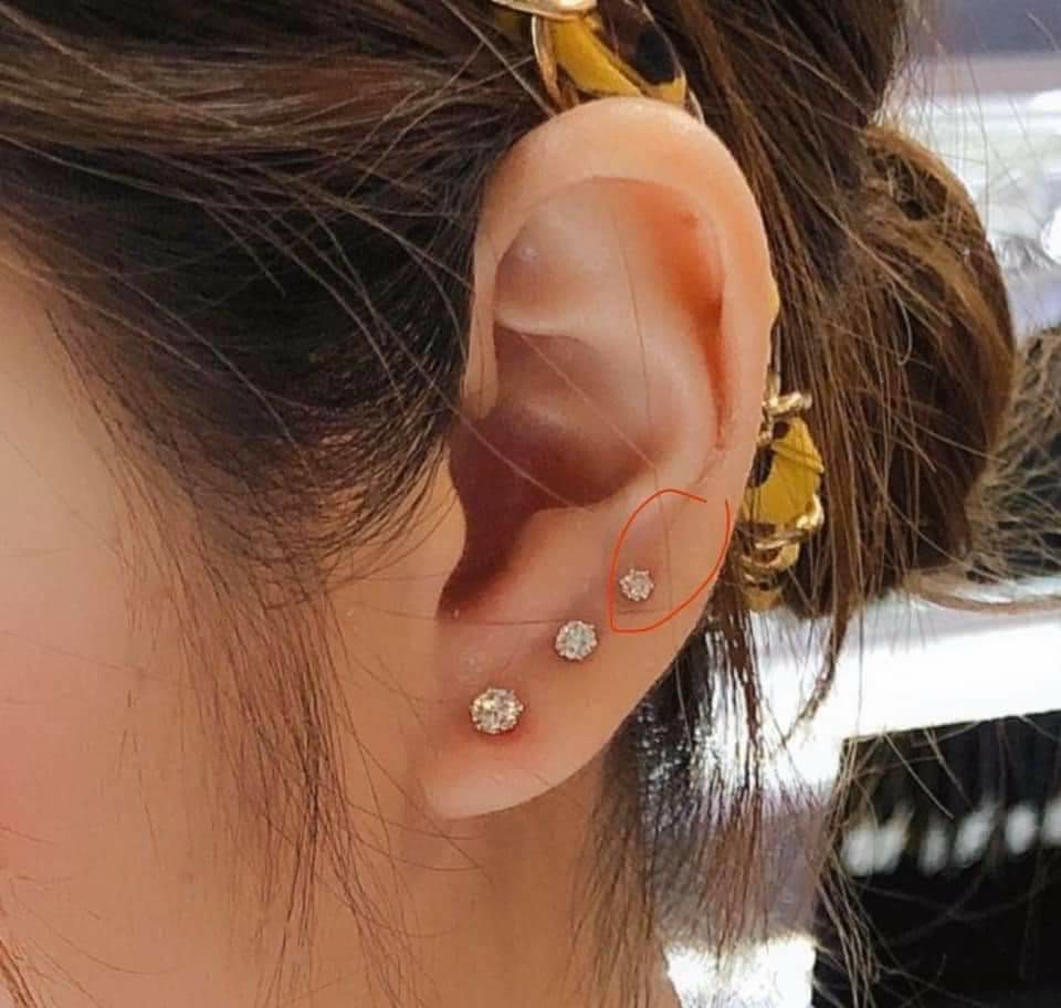 two ear piercings lobe