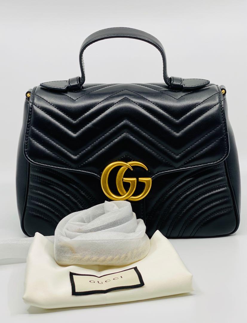 Authentic Gucci GG Marmont small top handle bag (Category: Luxury Bags & Wallets) located in Manila. Submitted by 2ndchancesale (Listing ID 1034767372, Image 1). Description: Authentic Preowned Like new IN BOX GUCCI GG Marmont small top handle bag 10/10 Black matelassé chevron leather with a heart Antique gold-toned hardware Double G Interior zip and open pockets Top handle with 8cm drop Detachable chain shoulder strap with 50cm drop Flap with sp