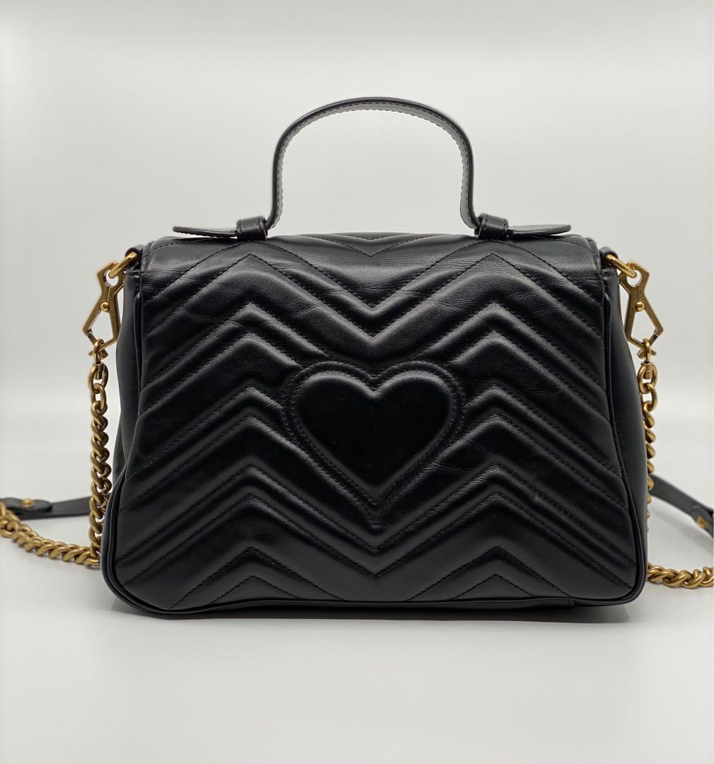 Authentic Gucci GG Marmont small top handle bag (Category: Luxury Bags & Wallets) located in Manila. Submitted by 2ndchancesale (Listing ID 1034767372, Image 3). Description: Authentic Preowned Like new IN BOX GUCCI GG Marmont small top handle bag 10/10 Black matelassé chevron leather with a heart Antique gold-toned hardware Double G Interior zip and open pockets Top handle with 8cm drop Detachable chain shoulder strap with 50cm drop Flap with sp