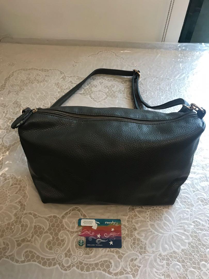 green leatherette sling bag