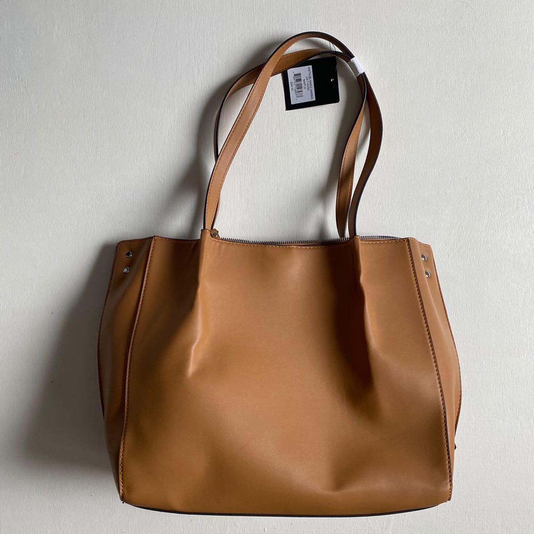 Nanette Lepore Anetta Bag (Category: Beach Bags) located in Paranaque City. Submitted by ooh.la.la (Listing ID 1034845614, Image 2). Description: Nanette Lepore Anetta Double Handle Handbag Brand new, bought in the US With Original tag - Dual top handles - Top zip closure - Exterior features front knot strap detail, logo accent, studded details, front and back slip pockets with magnetic closures - Interior features 2 media pockets and wall zip po